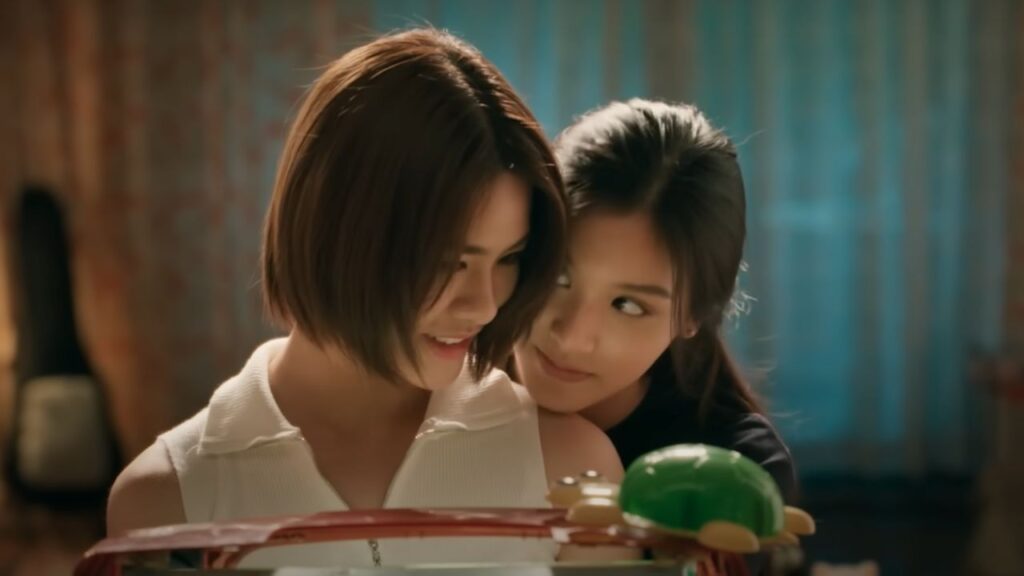 Closing emotional scene from US, a Thai GL drama, capturing hope and togetherness beyond critique.