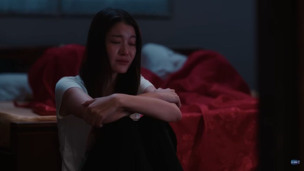 Ai‑oon from Pluto Thai TV Series alone in a reflective moment, symbolizing sacrifice and self‑worth.
