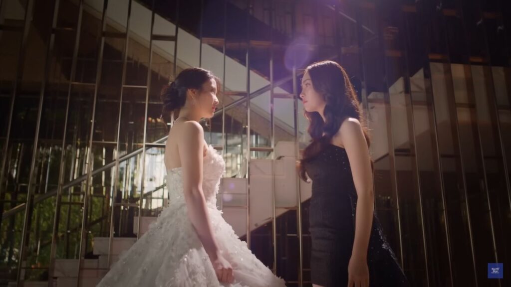 Intense moment between Premsini and Pat in Poisonous Love, illustrating scandal and romance in the Thai GL Multiverse.