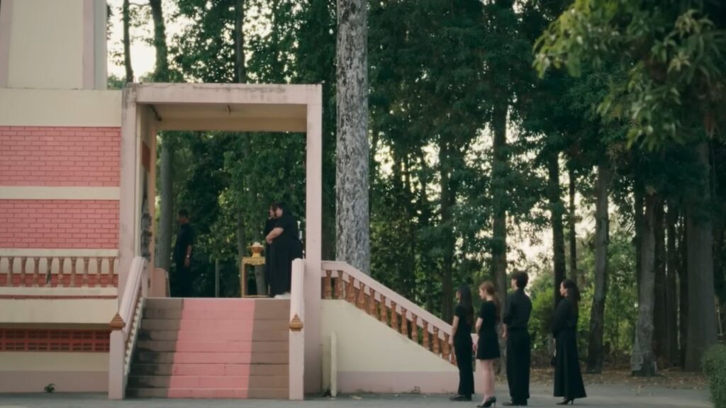 Emotional farewell scene in US, showing a nuanced portrayal of grief and quiet resilience.